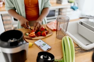 Woman chopping strawberries